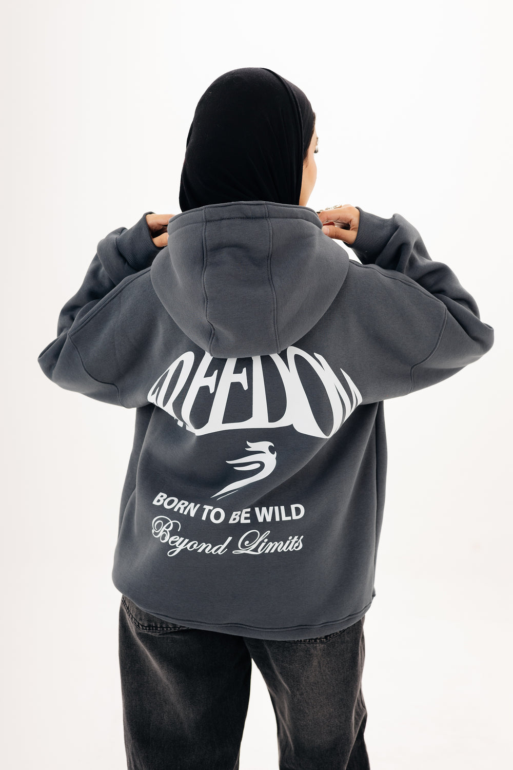 Unisex grey hoodie with Beyond Limits DTF back print by BLANCKA — on model
