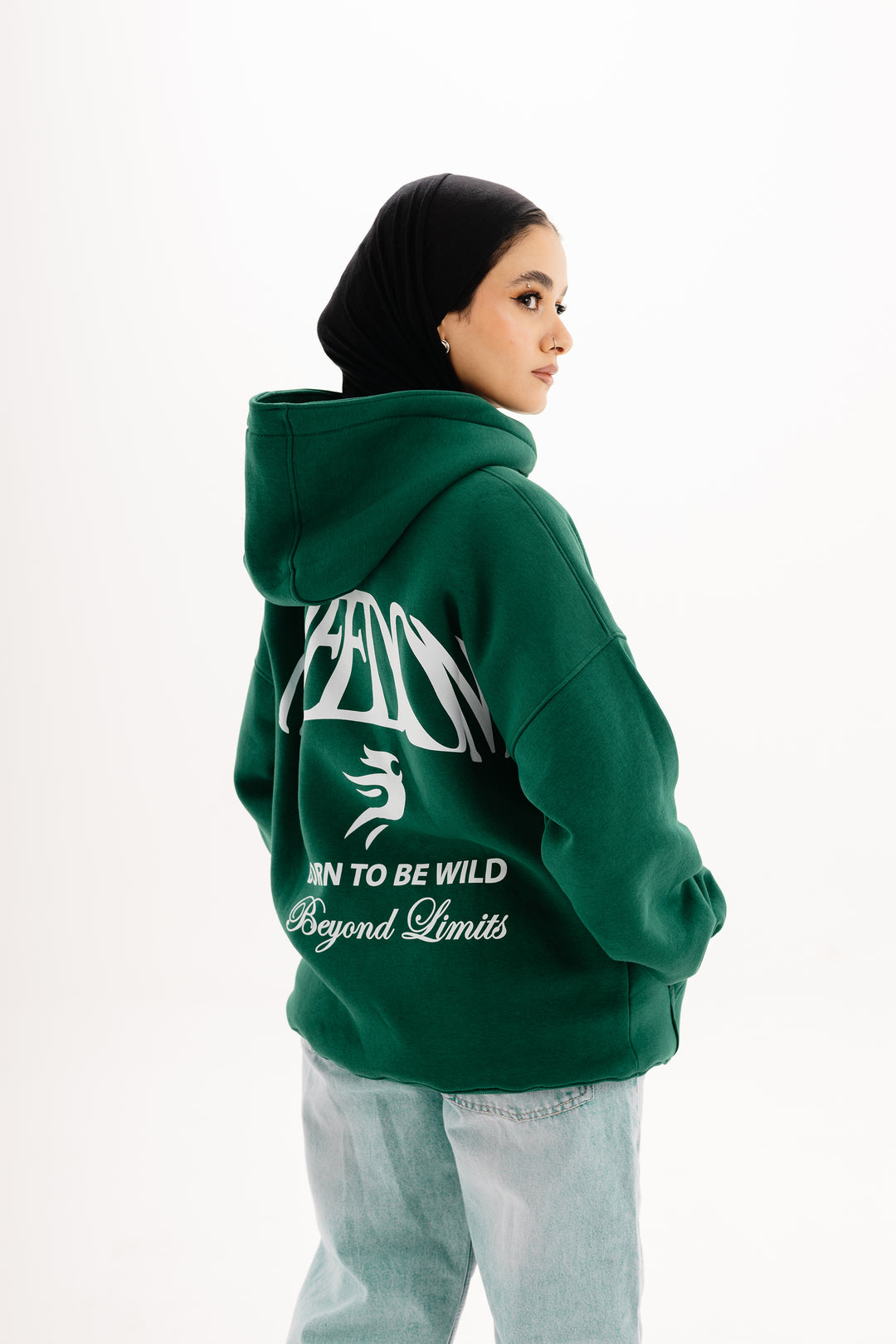 Unisex olive hoodie with Beyond Limits DTF print by BLANCKA — front and back view on model
