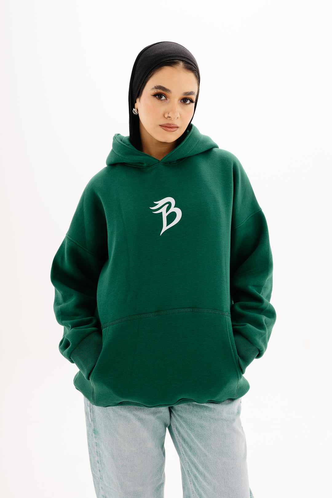 Unisex olive hoodie with Beyond Limits DTF print by BLANCKA — front and back view on model
