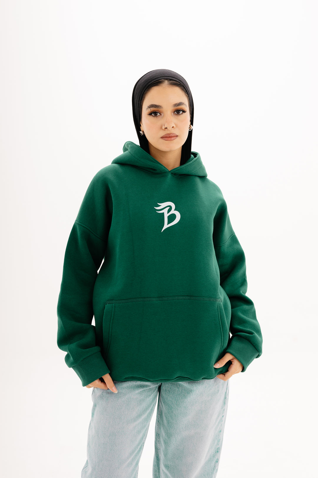 Unisex olive hoodie with Beyond Limits DTF print by BLANCKA — front and back view on model
