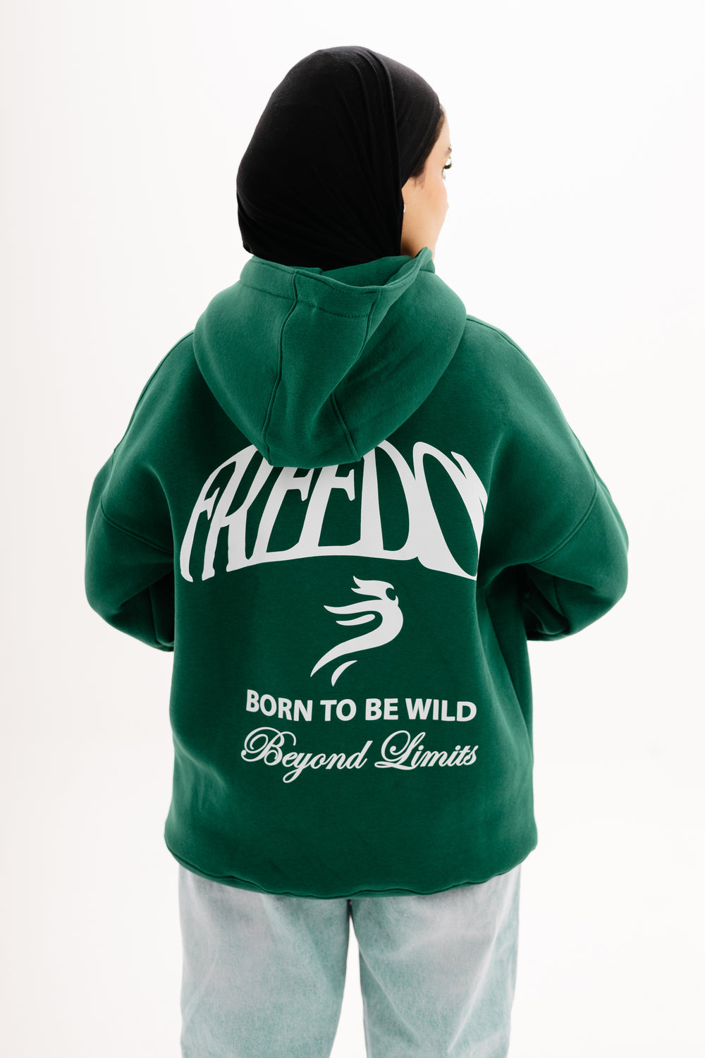 Unisex olive hoodie with Beyond Limits DTF print by BLANCKA — front and back view on model
