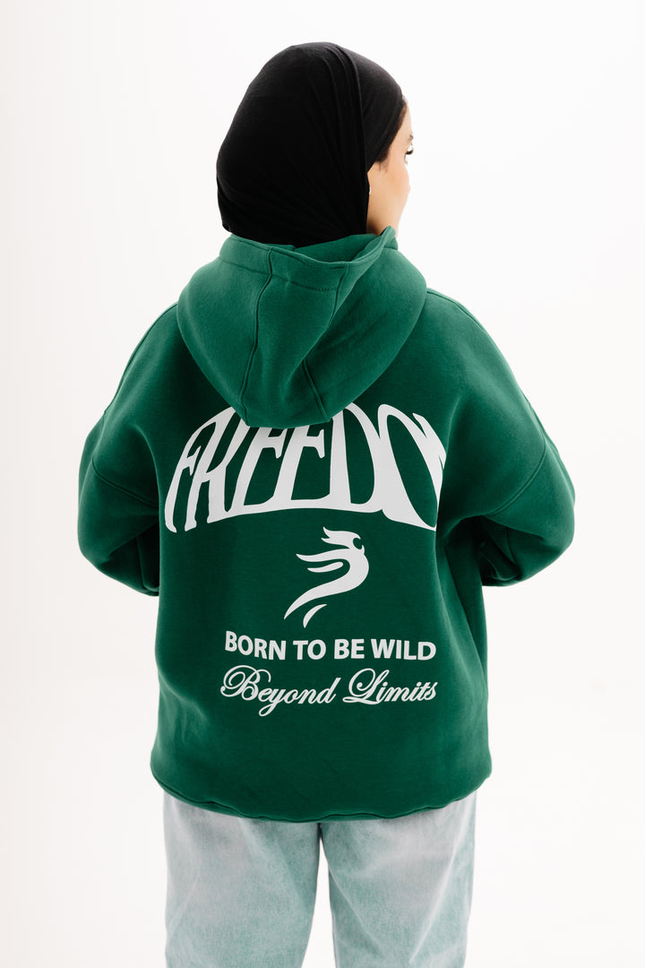 Unisex olive hoodie with Beyond Limits DTF print by BLANCKA — front and back view on model
