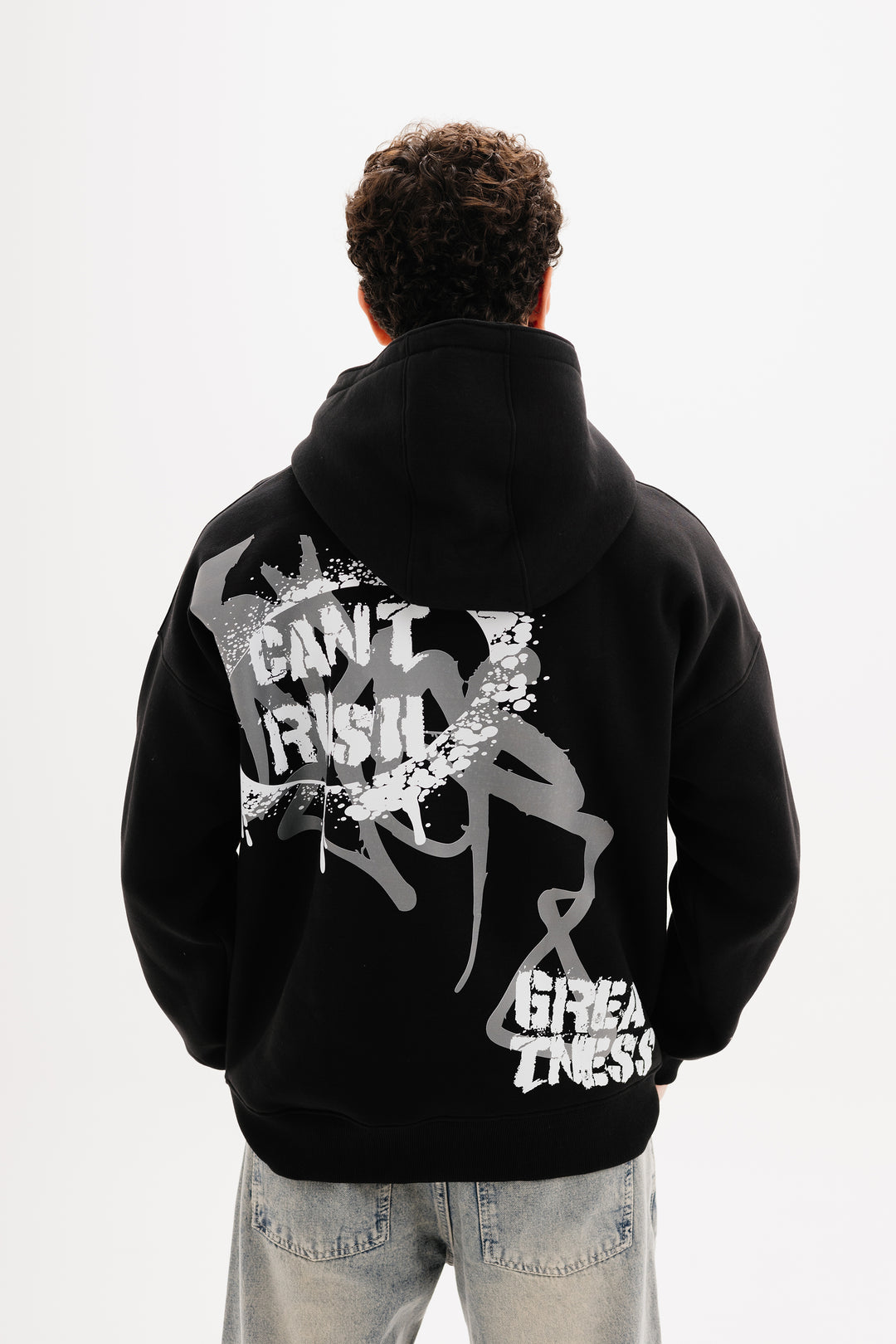 Unisex black hoodie with statement graffiti DTF print by BLANCKA — front and back view on model
