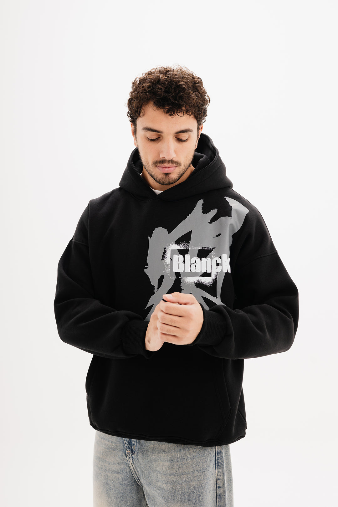 Unisex black hoodie with statement graffiti DTF print by BLANCKA — front and back view on model
