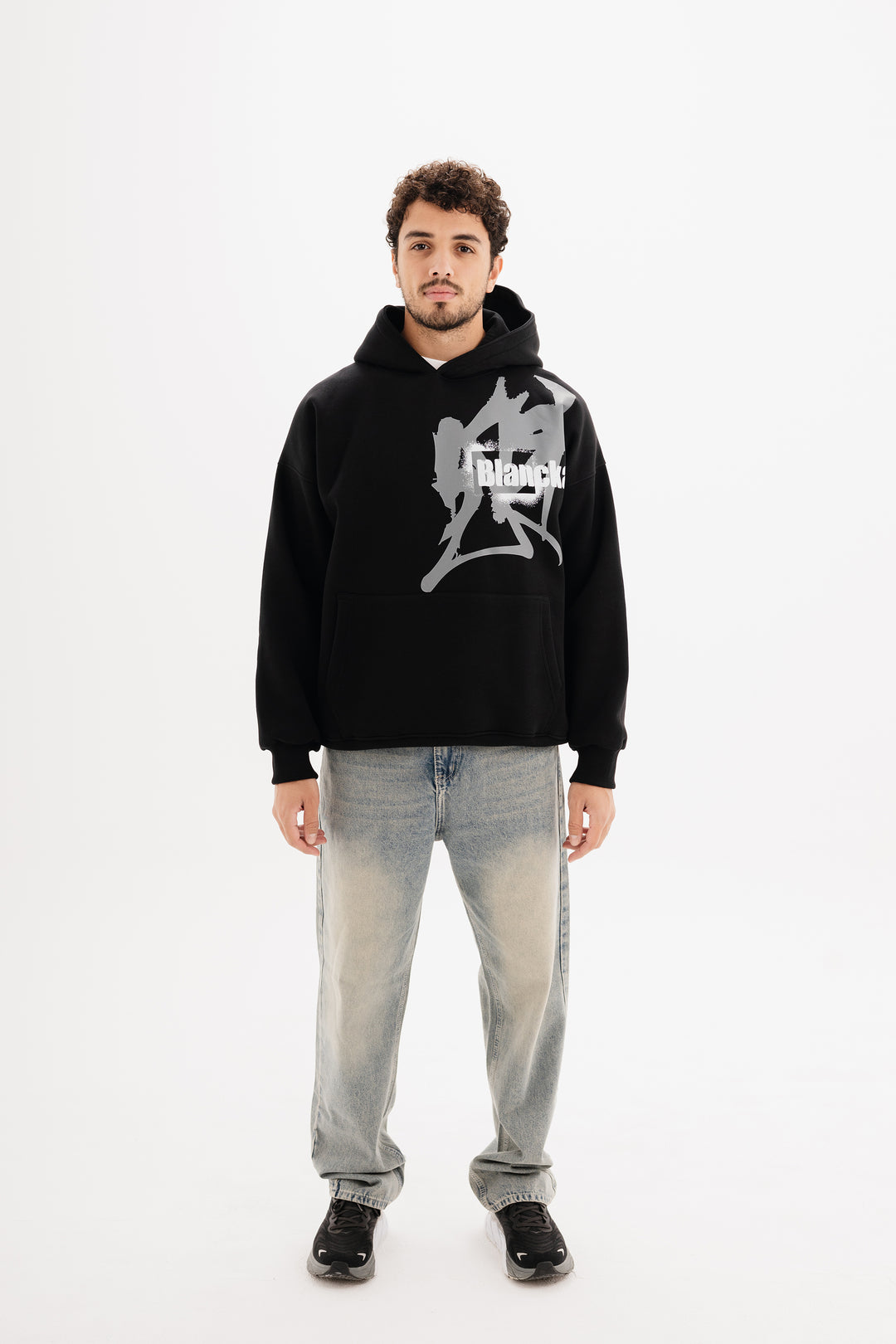 Unisex black hoodie with statement graffiti DTF print by BLANCKA — front and back view on model
