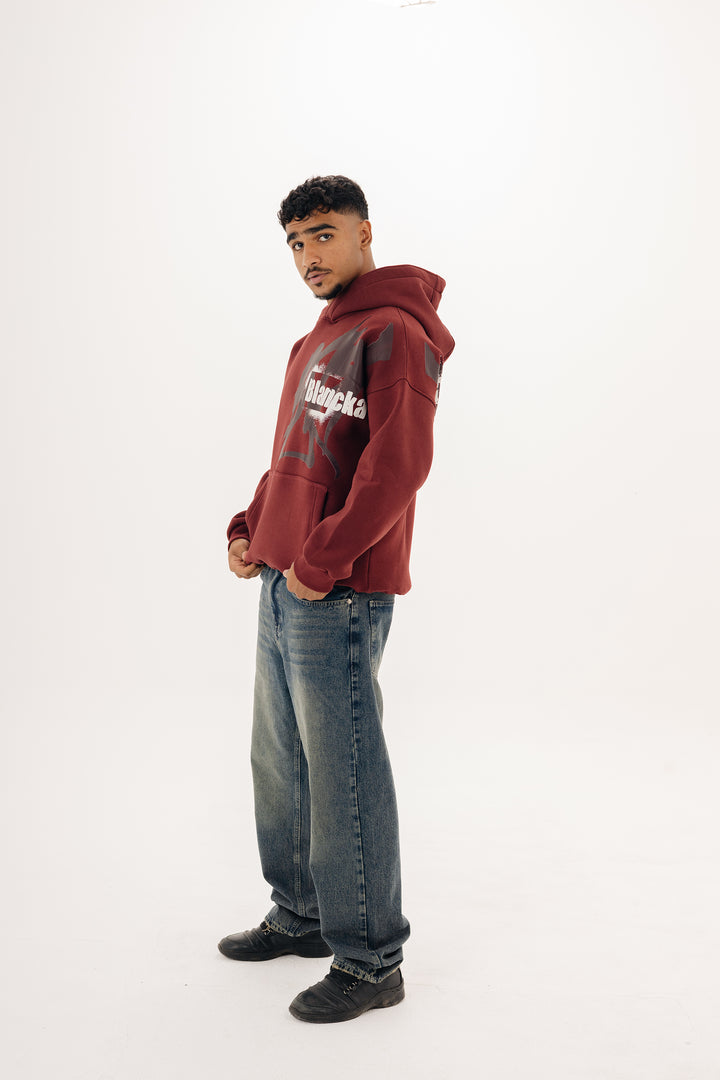 Unisex burgundy hoodie with statement graffiti DTF print by BLANCKA — front and back view on model
