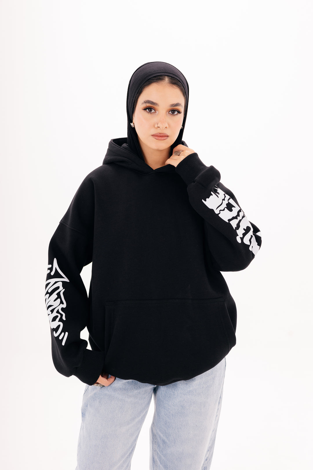Unisex black graffiti hoodie with white DTF print by BLANCKA — side and back view on model
