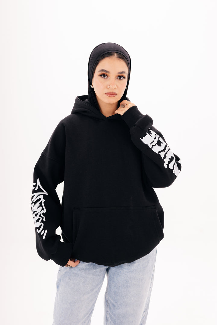 Unisex black graffiti hoodie with white DTF print by BLANCKA — side and back view on model
