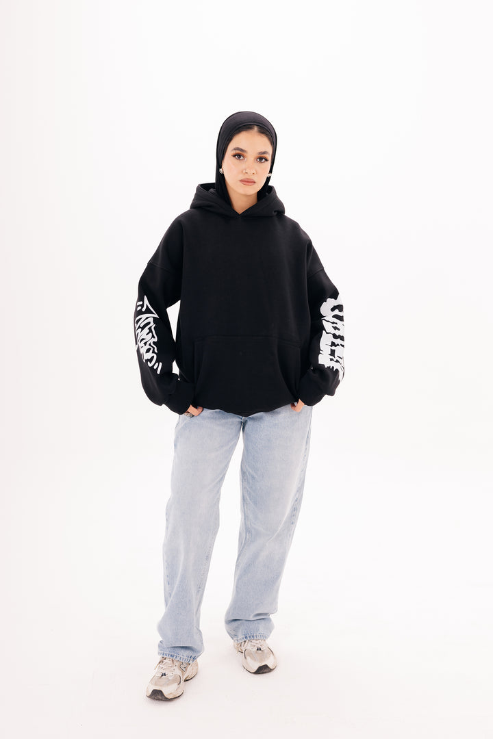 Unisex black graffiti hoodie with white DTF print by BLANCKA — side and back view on model

