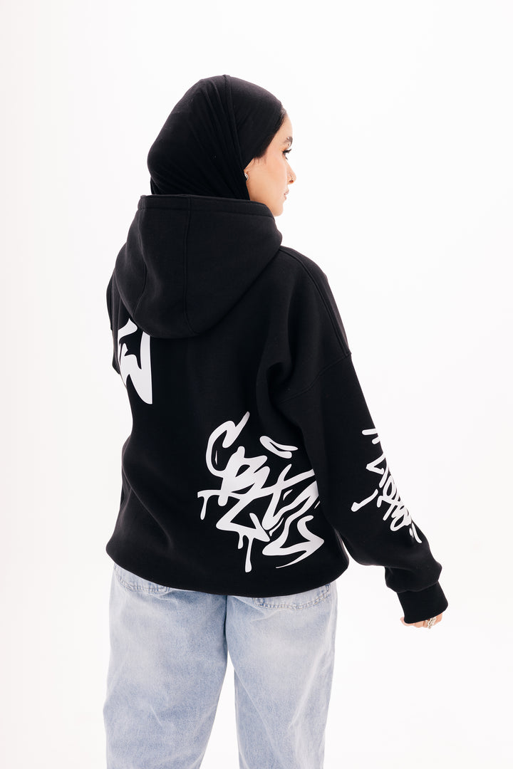Unisex black graffiti hoodie with white DTF print by BLANCKA — side and back view on model
