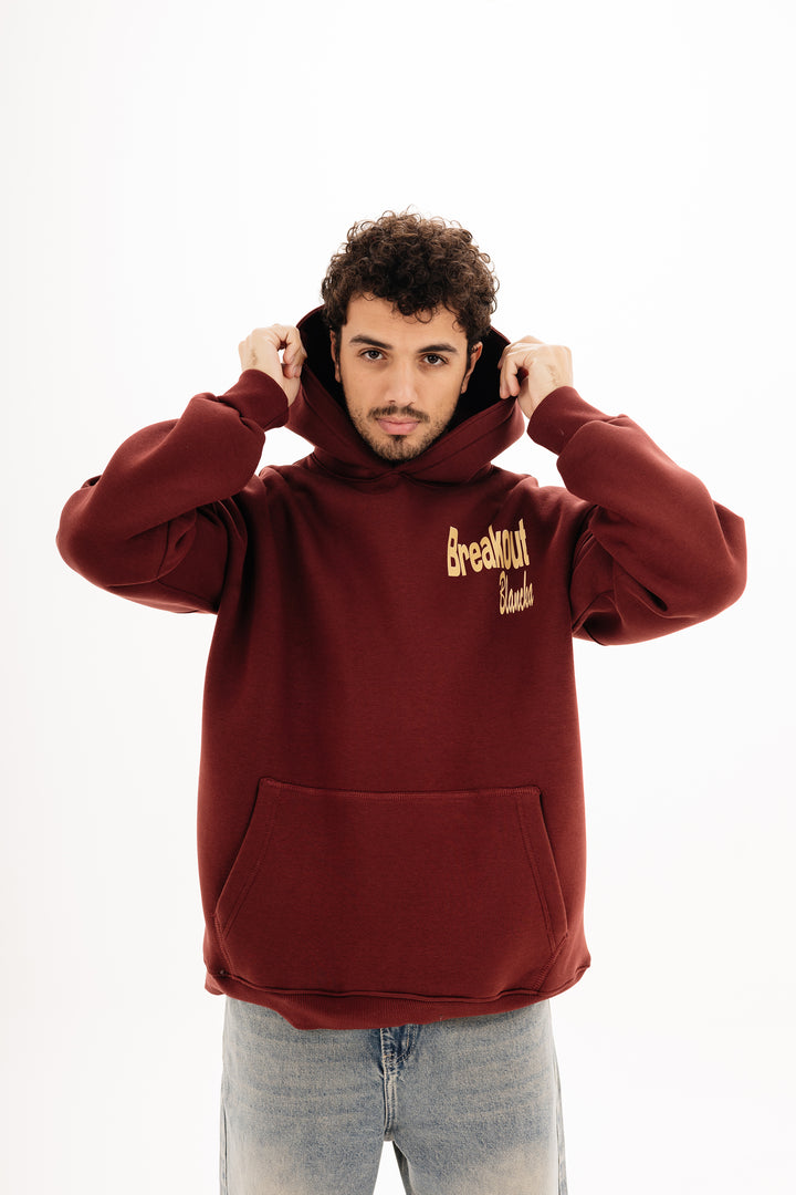 Unisex burgundy hoodie with DTF front and back print by BLANCKA — on model
Back view burgundy hoodie with built beyond graphic — on model
