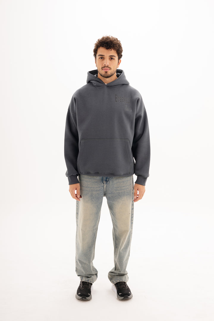 Unisex grey hoodie with black built beyond graphic by BLANCKA — front view on male model
Unisex grey hoodie with large back DTF print — back view on model
