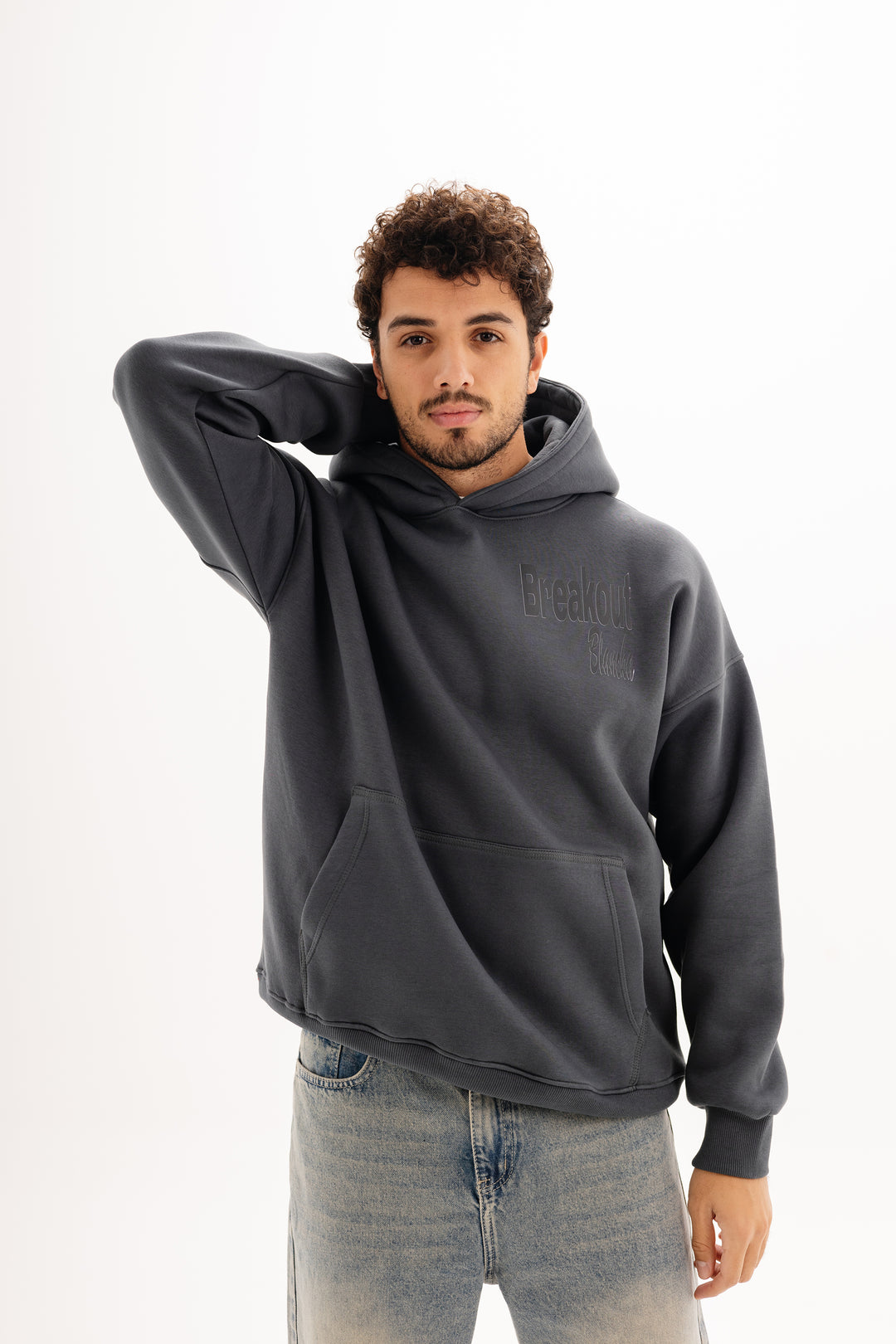 Unisex grey hoodie with black built beyond graphic by BLANCKA — front view on male model
Unisex grey hoodie with large back DTF print — back view on model

