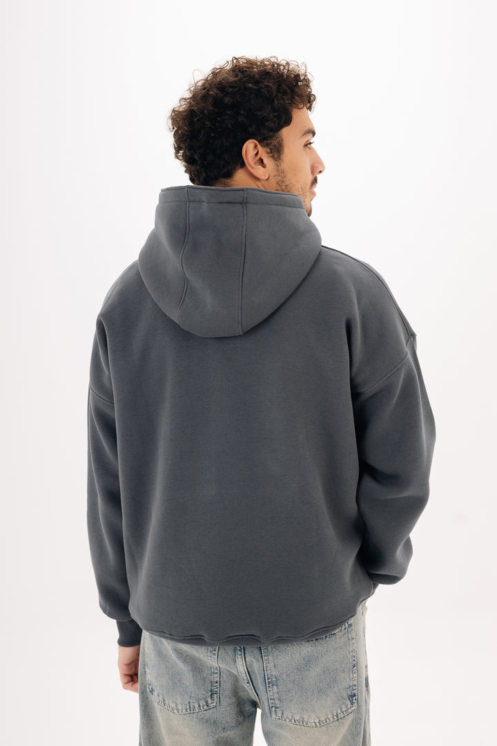 Basic grey boxy hoodie front view on modelBasic grey hoodie back view on modelUnisex essential hoodie in grey ? Blancka