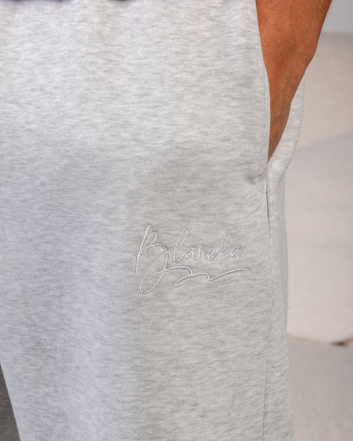 “Shaneh grey fleece sweatpants texture – BLANCKA embroidery close-up”