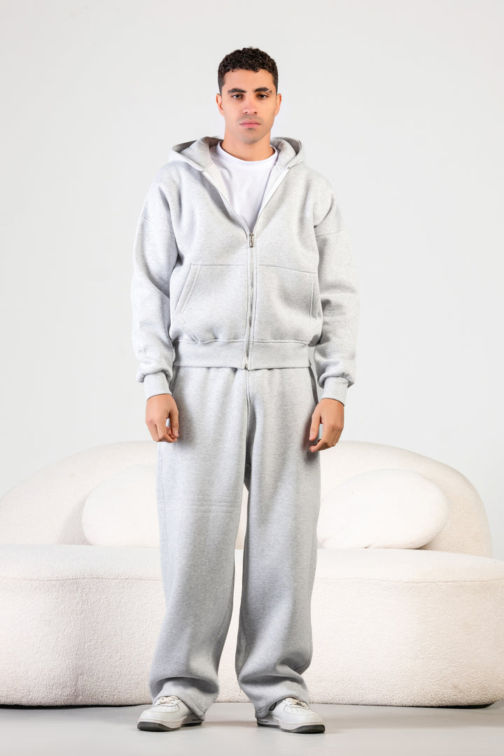 Unisex oversized zip hoodie set in charcoal grey with wide-leg sweatpants – BLANCKA Winter 2025.
