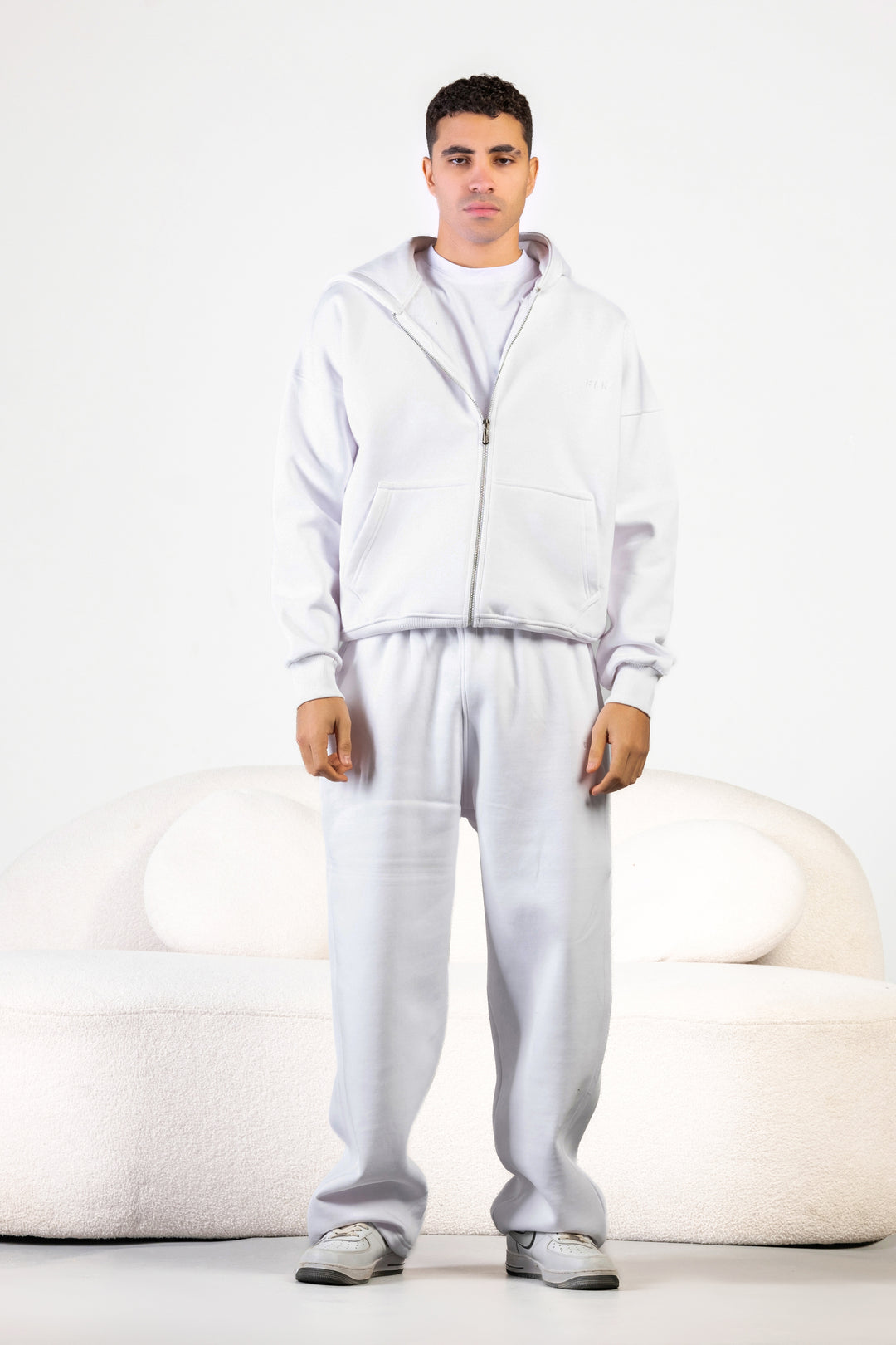 Unisex oversized zip hoodie set in charcoal grey with wide-leg sweatpants – BLANCKA Winter 2025.
